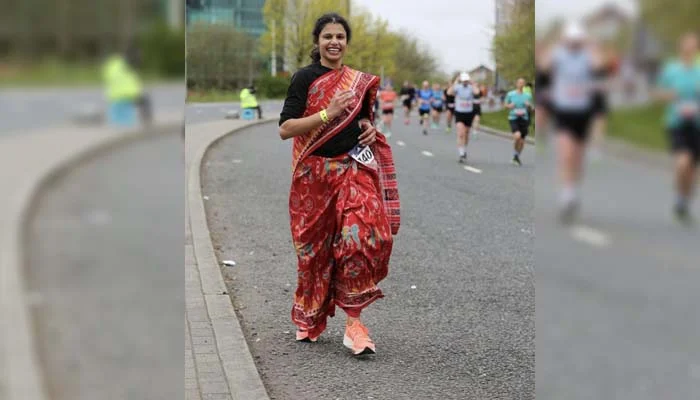 Indian woman running in a sari in the UK marathon 
